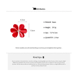 Detailed specs of large red resin flower earrings with size and material info