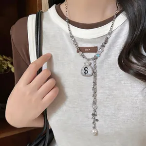 Full diamond money bag pendant necklace with an elegant pearl tassel drop for women