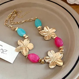 Elegant vintage gold metal flower pendant necklace with colorful pink and blue beads