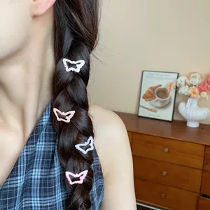 Detailed view of sweet butterfly-shaped hair clips in a girl's braided hair