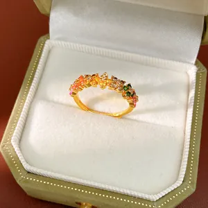 Detailed macro shot of a gold ring with vibrant multi-colored zirconia stones