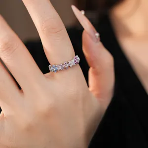 Close-up detail of an elegant ring featuring colorful cubic zirconia floral patterns.