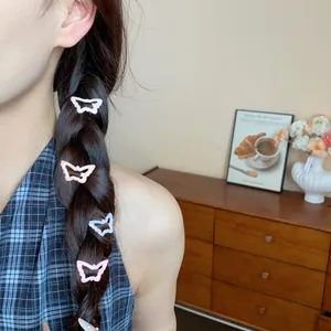 Detail of butterfly-shaped drip oil hair clips worn on a braided hairstyle, 4-piece set