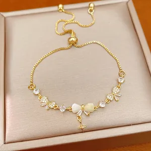 Elegant 18K gold plated adjustable bracelet featuring a zircon bow and star charm detail