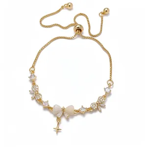 Elegant 18K gold plated adjustable bolo bracelet featuring zircon bows and a star pendant