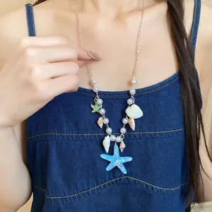 Handmade summer beach necklace with blue starfish shell charms and elegant pearls