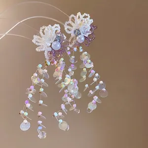 Dopamine style floral tassel earrings with iridescent sequins and pearl accents.