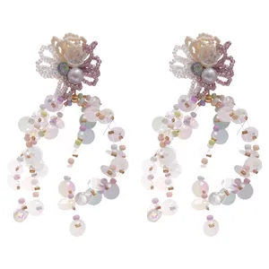 Dainty beaded flower tassel earrings with iridescent sequins for a dreamy summer look