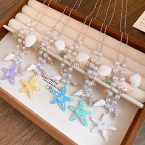 Close-up of beach-themed starfish and seashell pearl necklaces in various vibrant colors