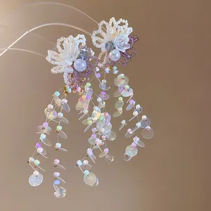 Detail shot of iridescent floral tassel earrings with colorful beads and sequins