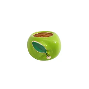 Vibrant green apple-shaped enamel ring with leaf detail, modern fruit jewelry