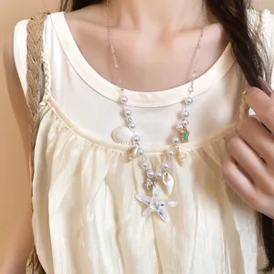 Close-up of summer starfish and shell necklace with pearls for a beach vacation look