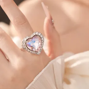 Exquisite close-up view of elegant heart-shaped pink zircon ring with sparkling halo crystals