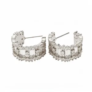 Silver-plated C-shaped hoop earrings featuring shimmering baguette and round cubic zirconia