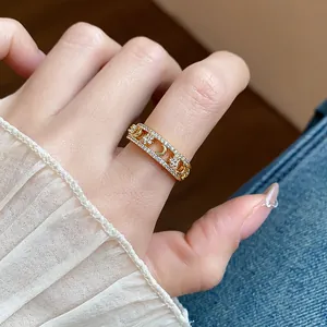 Detail view of 18K gold-plated star and moon ring with sparkling cubic zirconia