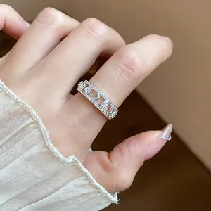 Detailed view of an 18k gold plated band ring featuring sparkly star and moon motifs