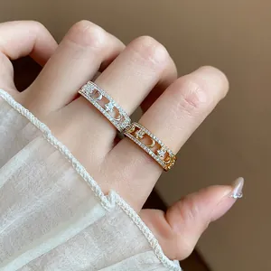 Macro view of 18k gold plated star and moon rings featuring sparkling zircon stones