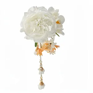 Elegant white fabric flower hair clip with pearl tassels and golden accents