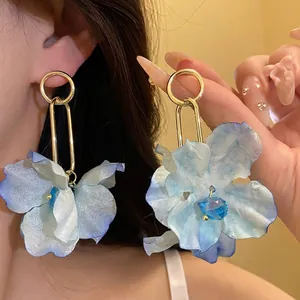 Elegant blue fabric flower drop earrings with gold metal links for seaside holiday