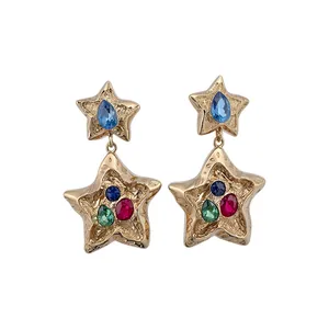 Vintage gold star drop earrings with multi-colored rhinestone accents in light luxury style