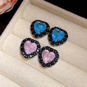 Elegant heart-shaped zircon stud earrings in blue and pink with black stone halo