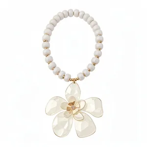 French vintage beaded necklace with rhinestone flower pendant on white background