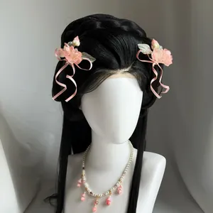 Close-up of pink flower ribbon bow hair clips and matching necklace on a mannequin