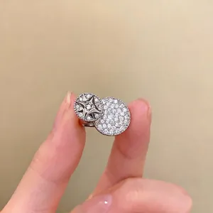 Elegant silver pavé zircon open ring featuring a celestial star and textured round disk