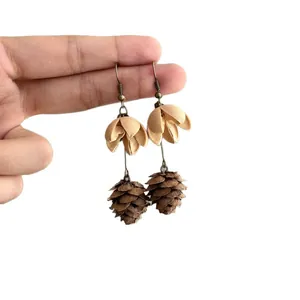 Handmade vintage ethnic style earrings featuring beige fabric petals and pine cone fruit dangles.