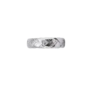 Elegant twisted braided silver ring with shimmering cubic zirconia stones on white background.