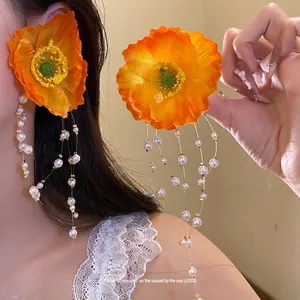 Sweet orange flower drop earrings with long pearl beaded tassels for a vacation