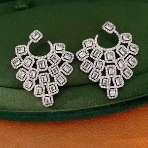 Macro view of heavy-duty geometric square zircon earrings with premium silver posts.