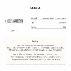 Detailed view of silver-tone twisted zircon ring with material and dimensions