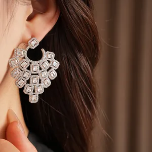 Detailed close-up view of geometric square earrings adorned with sparkling cubic zirconia stones