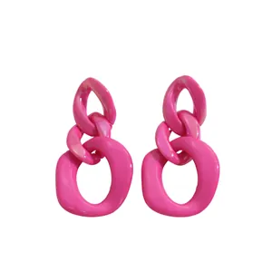 Vibrant bright pink acrylic chain link geometric earrings in a bold dopamine style