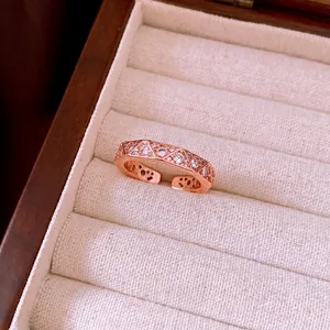 Vintage-inspired rose gold rhombus ring with full pavé diamonds, adjustable open design.