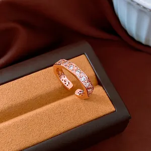 Macro detail of a vintage style rose gold rhombus ring with sparkling crystal stones
