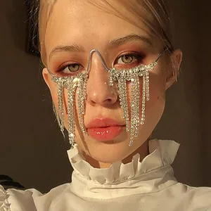 Close-up of avant-garde eyeglass frame with shimmering long rhinestone tassels decoration