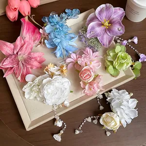 Floral fabric hair clips set with elegant pearl tassels and lily of the valley charms