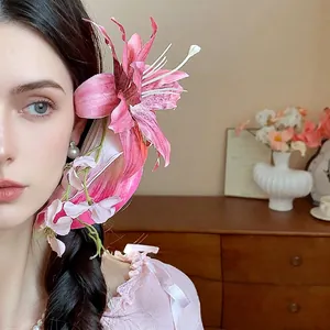 Elegant pink lily fabric flower hair clip with pearl tassel for resort style