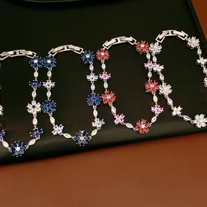 Detailed close-up of vintage flower bracelets featuring colorful zircon inlays and secure clasp.