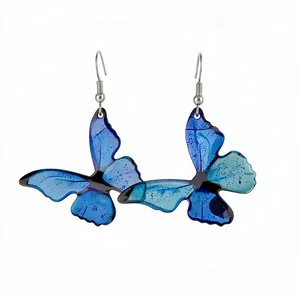 Elegant blue gradient resin butterfly drop earrings with shimmering glitter and silver hooks