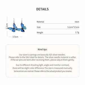Detailed product specifications of blue resin butterfly earrings with size and weight