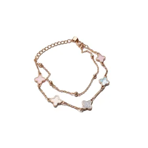 Elegante pulsera de doble hilo chapada en oro rosa de 18k con flores de circón