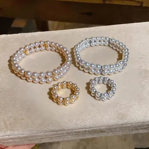 Elegant double-layered pearl bracelet and ring set in gold and silver finishes for women
