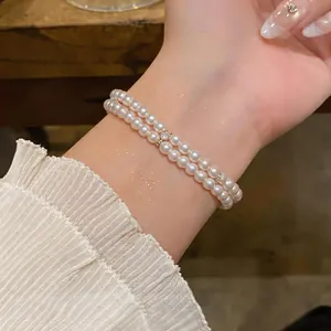 Close-up of elegant double-layer pearl bracelet with 18K gold-plated accents