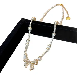 Elegant French style pearl necklace with gold zircon bow pendant for fashion women