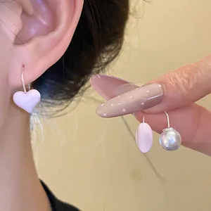 Elegant silver needle pink enamel heart and pearl drop earrings with a vintage minimalist design