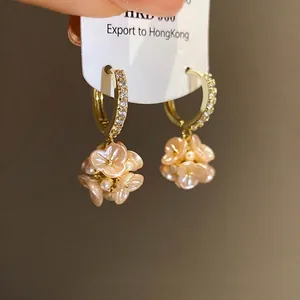 Elegant pale pink flower dangle earrings with pearls and crystal-encrusted gold hoops