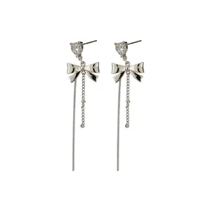 Elegant silver bowknot tassel earrings with heart zircon studs and long chain fringes.